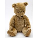 A 20th century blonde plush Teddy bear:, glass eyes,