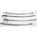 A pair of reproduction British pattern cavalry swords:, both with curved blades,