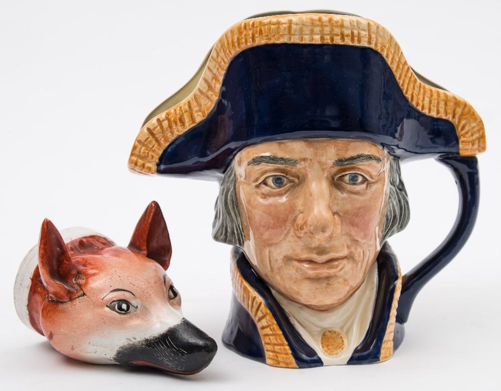 A late 19th century Continental fox head stirrup cup,