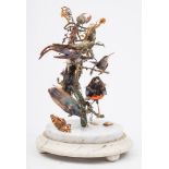 A Victorian taxidermy group of humming birds:, set on branches with another bird,