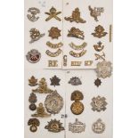 A group of WWI and later cap badges and helmet plates:, including Argyll & Sutherland,