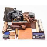 A lacquered brass 3 inch surveying compass by Newton & Co, London:, in a brown leather case,