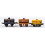 Hornby O gauge, a group of six petrol tank wagons:, ' Motor BP Spirit', 'Pratts', 'Redline',