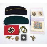 A German Third Reich NSDAP armband:, together with a Bronze Spanish Cross, an eagle tie pin,