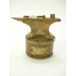An apprentice brass model of an anvil:,