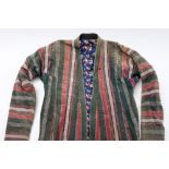 An Uzbek chapan of green , red and silver stripes with printed cotton lining:.