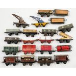 Hornby O gauge a group of goods wagons:, two crane trucks, a rotary tipping wagon,