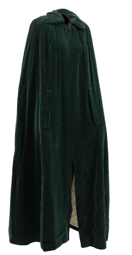 A Quad green velvet cape:, with quilted lining and black frogging to collar,