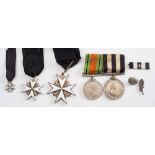 A WWII period Order of St John neck badge:, together with shoulder badge and miniature,