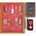 A framed group of WWII service medals and miniatures:, comprising 1939-45 Star and miniature,