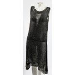 An early 20th century black cotton and beadwork dress:, circa 1920s,