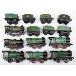 A group of seven Hornby O gauge tank locomotives and tenders in green:, various cab numbers.