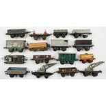 Hornby O gauge a group of goods wagons:, two crane trucks, a side tipping wagon,