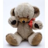 A Merrythought white plush Teddy bear:, with resin eyes, stitched nose and mouth and felt pads,