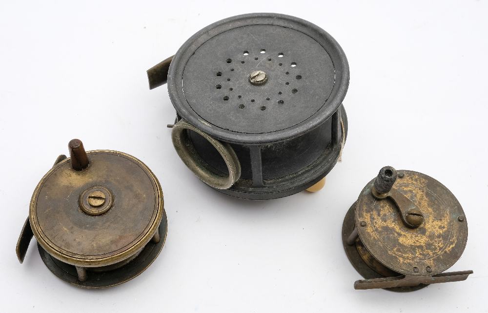 A Hardy 3 1/2 inch 'Perfect' reel and two brass four bar reels.: (a/f) (3).