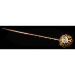 A 19th century gold and diamond single-stone stick pin: the cushion-shaped,