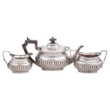 A Victorian bachelor's silver three-piece tea service, maker Henry Atkin, Sheffield,