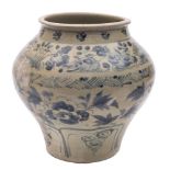A Chinese blue and white 'fish' jar: of compressed globular form with rolled rim,