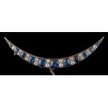 A 19th century sapphire and diamond crescent brooch: with cushion-shaped sapphires between pairs of