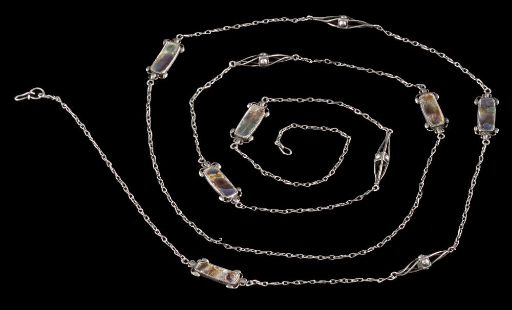 An Arts and Crafts silver and paua shell long chain: of handmade figure of eight links interspersed