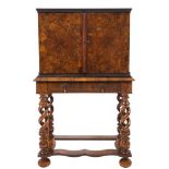 An early 18th Century walnut oyster veneer and parquetry cabinet on a later stand:,