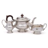 A George V silver three-piece tea service, maker Adie Brothers Ltd, Birmingham,