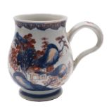 A Chinese Imari baluster mug and a Chinese famille rose crested cylindrical tankard: the first with