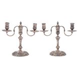 A pair of Elizabeth II silver twin branch candelabra, maker Nayler Brothers, London,