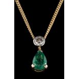 An emerald and diamond two-stone pendant: the round brilliant-cut diamond estimated to weigh 0.