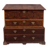 A walnut oyster veneered banded and inlaid chest in the William and Mary taste:, on a later base,
