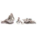 A pair of Meissen figural salts: in the form of a reclining gallant and female companion wearing