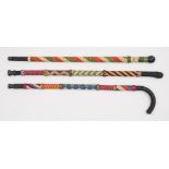 Ray Tucknott, two multicoloured ropework walking canes and a walking stick:.