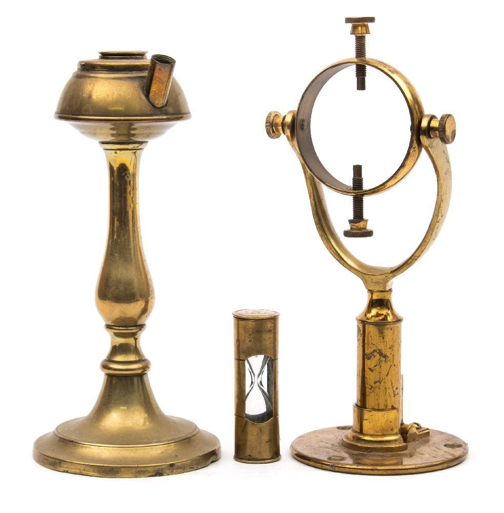 A late 19th century brass whale oil lamp:, on baluster support, 23cm high,