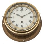 A circular brass bulkhead 'Master' clock:,