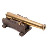 A 20th century brass model of a cannon:,