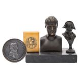 A 19th century bronze bust of Napoleon after Rodin: on a black slate base, 13cm high,