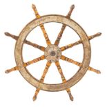 A teak and iron ship's helm:, unsigned, of typical form with iron boss and banded rim,