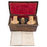 A WWII period Royal Navy Regulation bicorn hat and epaulettes in Russian lacquer trunk:,