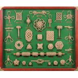 Ray Tucknott. A framed knotwork display board:, on a green ground with gilt brass name plates, 46.
