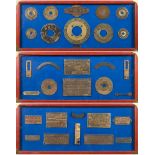 A collection of salvaged ships' brass plaques:, mounted in three framed display boards,