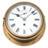 A ship's brass bulkhead clock:, unsigned,