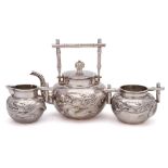 A late 19th century Chinese silver three-piece tea service, maker Wang Hing & Co,