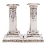A pair of Edward VII silver neo-classical silver candlesticks, maker Thomas Bradbury & Sons, London,