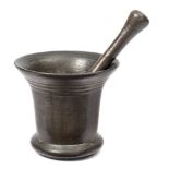 A Georgian bronze mortar: of traditional design, 13cm. high, together with a pestle.