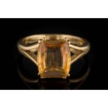 A rectangular topaz single-stone ring: approximately 11mm long x 9mm wide x 4mm deep,