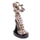 A Goldscheider figure of a jester: playing a pipe and leaning against a column draped with a cloth,