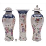 A garniture of three Chinese porcelain vases: comprising a trumpet vase and two baluster vases and