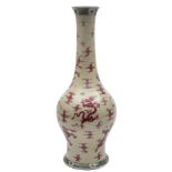 A Chinese copper red and yellow ground dragon vase: with ovoid body and long slender neck,