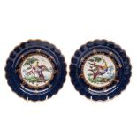 A fine pair of First Period Worcester 'wet' blue ground dishes: each with lobed rim,