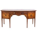 A late George III mahogany and inlaid bow-fronted sideboard,: bordered with boxwood,